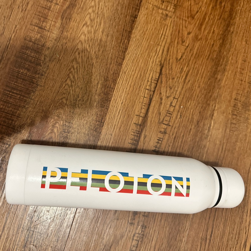Peloton White Bottle with Red, Blue, Yellow Stripe Logo